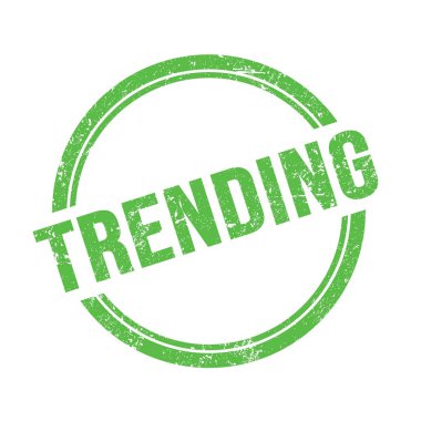 Yeşil grungy vintage yuvarlak damga üzerine yazılmış TRENDING metin.