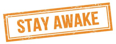 Turuncu eski dikdörtgen damgalı Uyanık Kal metni.