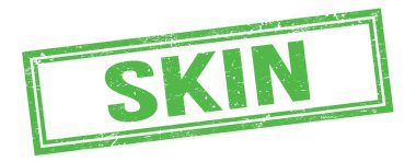Yeşil grungy vintage dikdörtgen damgalı SKIN metin.