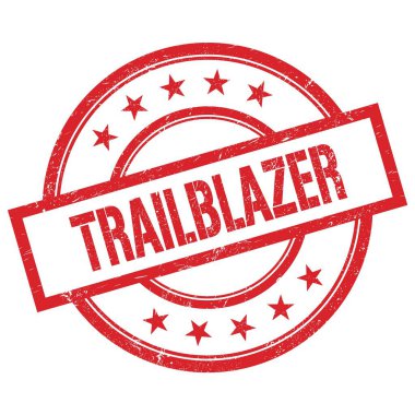 TRAILBLAZER kırmızı yuvarlak lastik damga üzerine yazılmış metin.