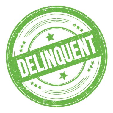 Yeşil yuvarlak, kirli doku damgası üzerine DELQUENT metni.