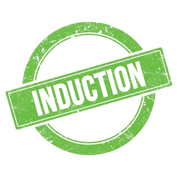 Yeşil grungy yuvarlak vintage pul üzerinde INDUCTION metin.