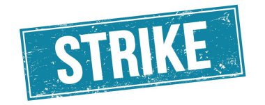 Mavi grungy dikdörtgen damga işareti üzerinde STRIKE metin.