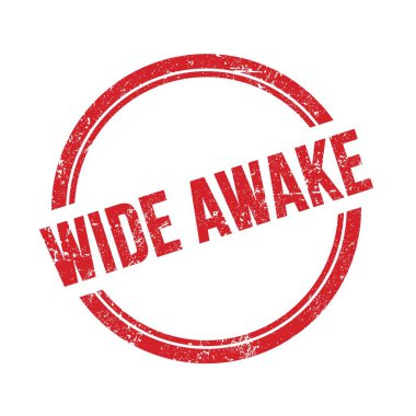 Kırmızı grungy vintage yuvarlak damga üzerine yazılmış WIDE Awake metni.