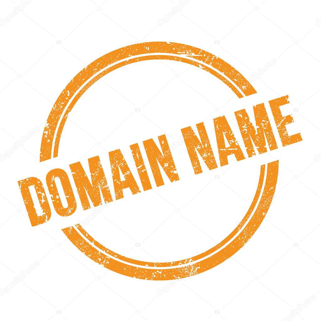 DOMAIN NAME text written on orange grungy vintage round stamp.