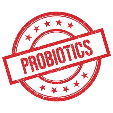 Kırmızı yuvarlak plastik damga üzerine yazılmış PROBIOTICS metni.