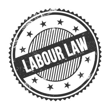 LABOUR LAW text written on black grungy zig zag borders round stamp.