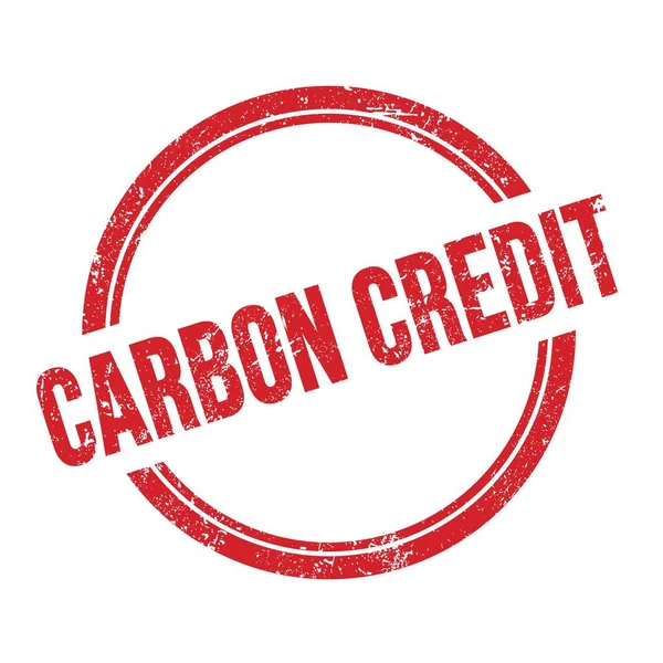 Kırmızı grungy vintage yuvarlak pul üzerine yazılmış CARBON CREDIT metni.