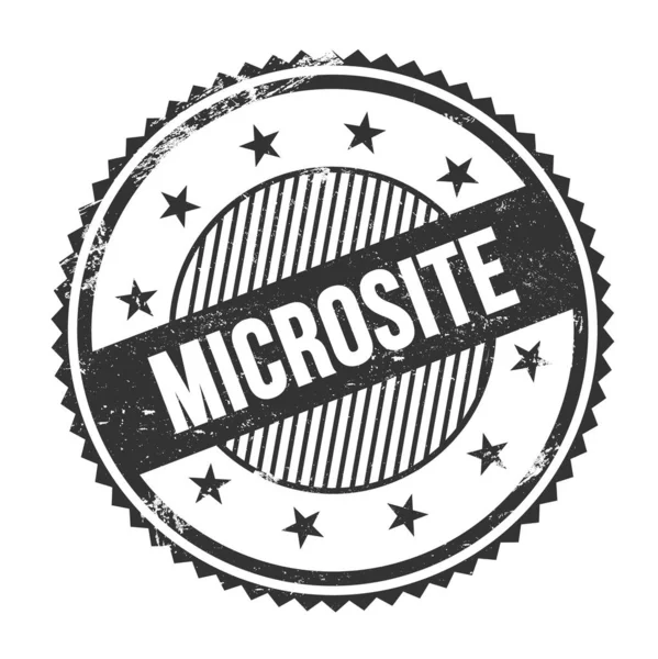 ブラックグランジージグザグボーダーラウンドスタンプに書かれたマイクロサイトテキスト — ストック写真