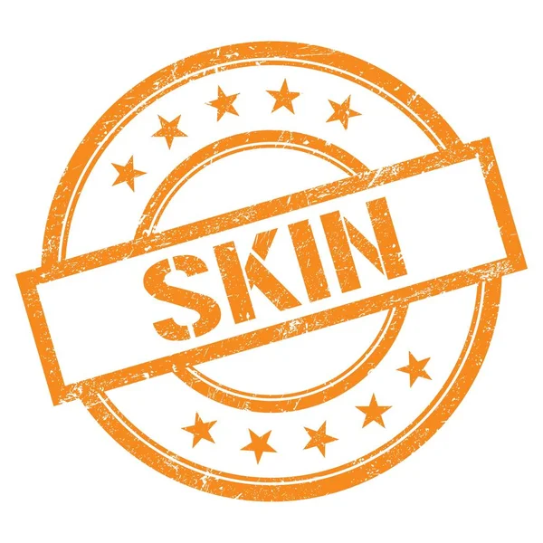 Turuncu yuvarlak vintage kauçuk damgalı SKIN metin.