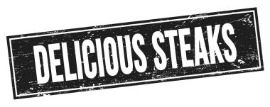Siyah grungy dikdörtgen damga işareti üzerine DELİOUS STEAKS metni.