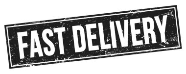 FAST DELIVERY text on black grungy rectangle stamp sign.