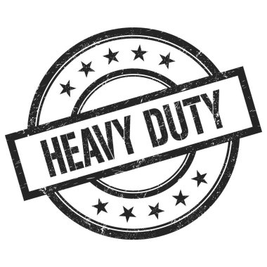HEAVY DUTY text written on black round vintage rubber stamp.