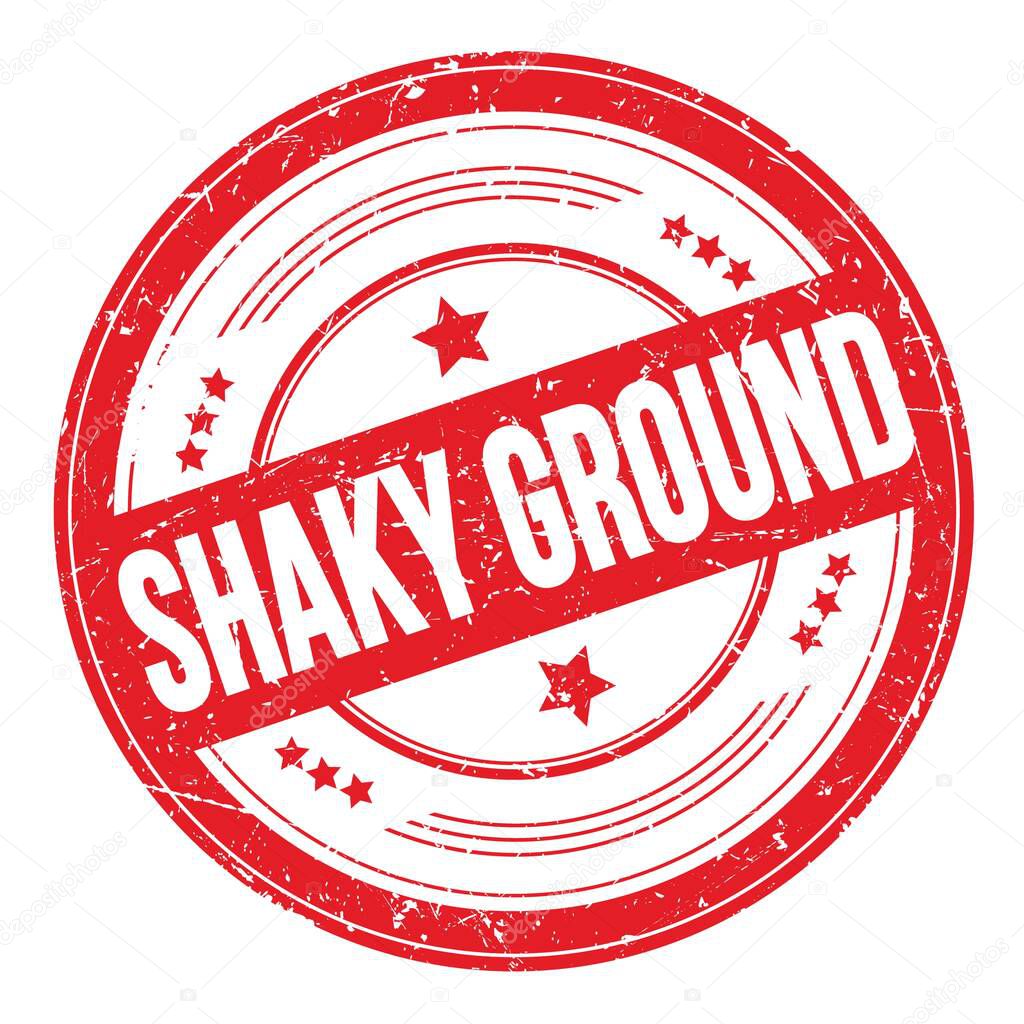 SHAKY GROUND text on red round grungy texture stamp.