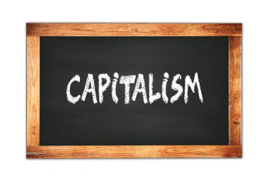 CAPITALISM text written on black wooden frame school blackboard.