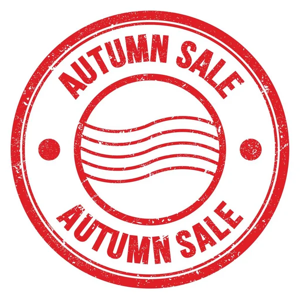 Kırmızı yuvarlak posta pulu işareti üzerine AUTUMN satış kelimesi