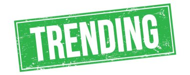 Yeşil grungy dikdörtgen damga işareti üzerinde TRENDING metin.