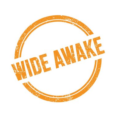 Turuncu grungy vintage yuvarlak damgalı WIDE AWAKE metni.