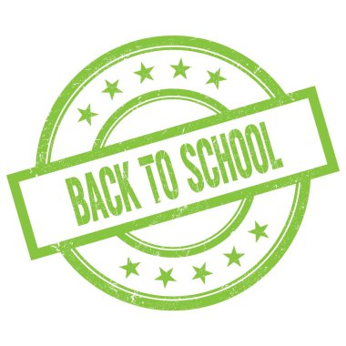 Yeşil yuvarlak vintage kauçuk damga üzerine yazılmış okula dönüş metni.