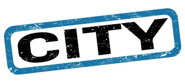 Mavi-siyah dikdörtgen işareti üzerine yazılmış şehir metni.