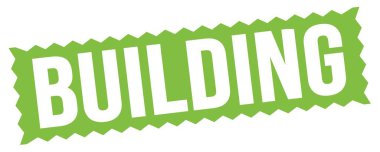 Yeşil zig-zag işareti üzerine yazılmış Bina metni.