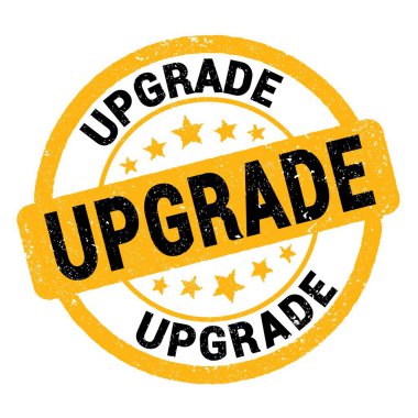 Sarı-siyah grungy işareti üzerine yazılmış UPGRAD metni.