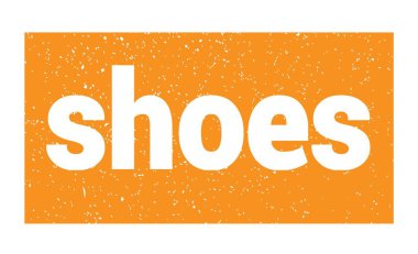 shoes text written on orange grungy stamp sign.