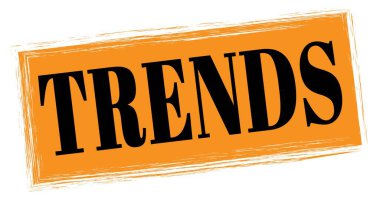 Turuncu-siyah dikdörtgen işareti üzerine yazılmış TRENDS metni.