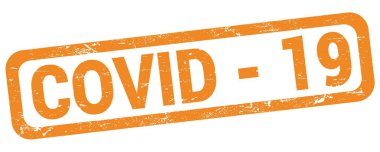 COVID - 19 text written on orange rectangle stamp sign.