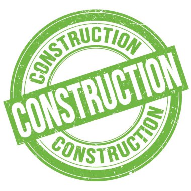 Yeşil yuvarlak grungy işareti üzerine yazılmış CONSTRUCTION metin
