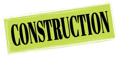 Yeşil-siyah dikdörtgen işareti üzerine yazılmış CONSTRUCTION metni.
