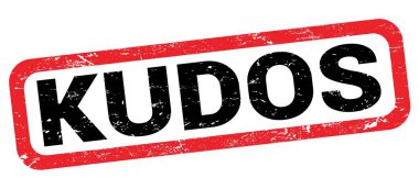 Kırmızı-siyah dikdörtgen işareti üzerine yazılmış KUDOS metni.