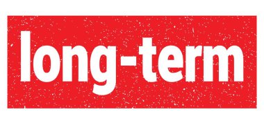 long-term text written on red grungy stamp sign.