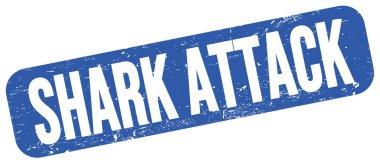 SHARK ATTACK text written on blue grungy stamp sign.