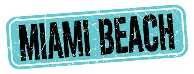 MIAMI BEACH text written on blue-black grungy stamp sign.