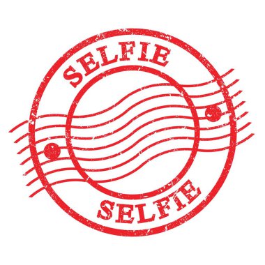 SELFIE, text written on red grungy postal stamp.