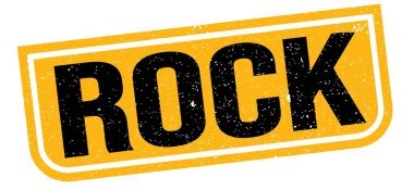 ROCK text written on yellow-black grungy stamp sign.