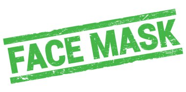FACE MASK text written on green rectangle stamp sign.