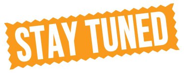 STAY TUNED text written on orange zig-zag stamp sign.