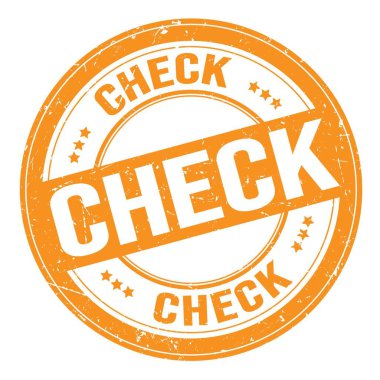 CHECK text written on orange round grungy stamp sign