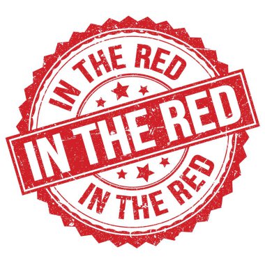 Kırmızı yuvarlak damga işareti üzerine yazılmış kırmızı metin