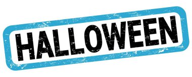 Mavi-siyah dikdörtgen işareti üzerine yazılmış Cadılar Bayramı metni.