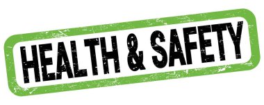 Yeşil-siyah dikdörtgen işareti üzerine yazılmış Sağlık & Güvenliği metni.