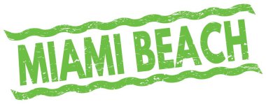 MIAMI BEACH metni yeşil çizgiler işareti üzerine yazılmış.