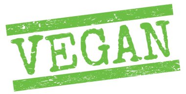 Yeşil grungy satır işareti üzerine yazılmış VEGAN metni.