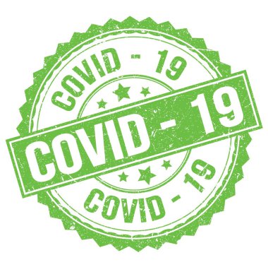 COVID - Yeşil yuvarlak pul işareti üzerine yazılmış 19 metin