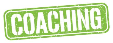 Yeşil grungy mühür işareti üzerine yazılmış koçluk metni.