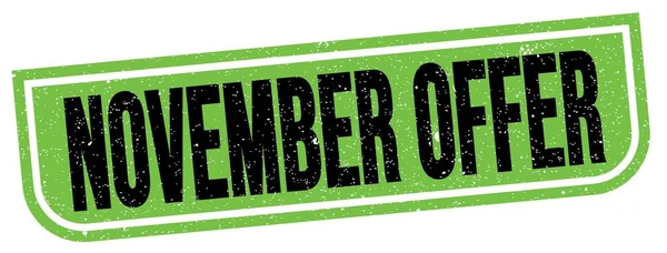 NOVEMBER OFFER text written on green-black grungy stamp sign.