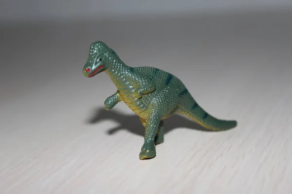 Toy dinosaur on white background