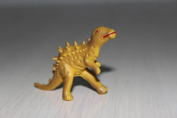 Toy dinosaur on white background